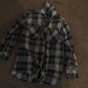 A black white grey and blue plaid shirt